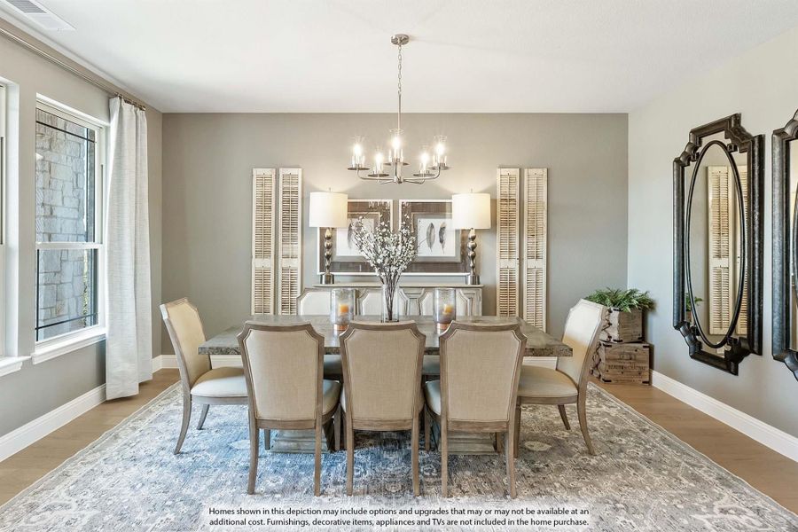Formal dining room with rectangular table, eight upholstered chairs, chandelier, and decorative wall mirrors on hardwood floors