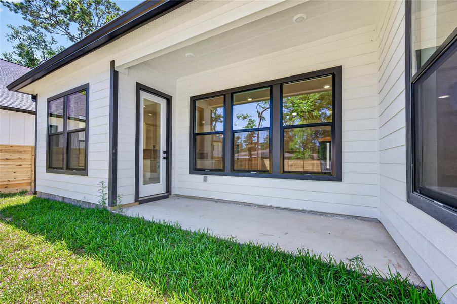 Exterior details and patio area of a home in , Conroe (Image 32).