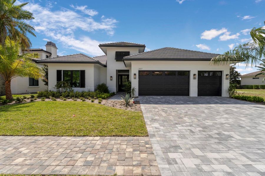Front exterior of a new home in , Port St. Lucie, FL, highlighting curb appeal (Image 22).