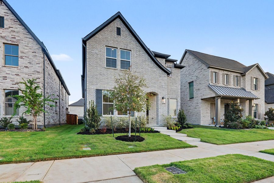 Front exterior of a new home in Light Farms Brenham - 40' Lots, Celina, TX, highlighting curb appeal (Image 21).