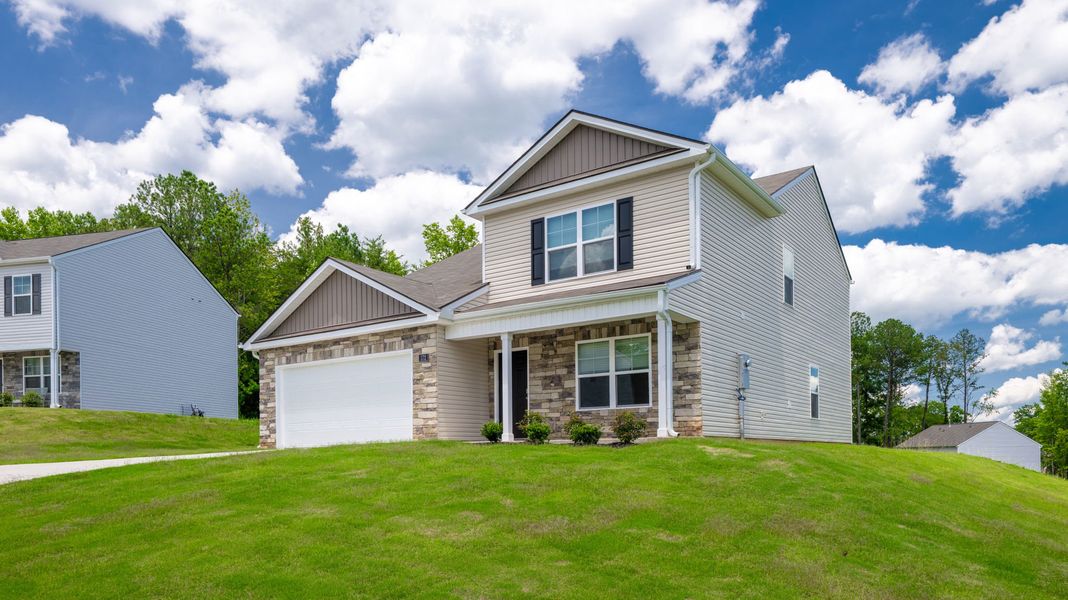 Front exterior of a new home in Byrd Farms, Dayton, TN, highlighting curb appeal (Image 2). Front exterior of a new home in Byrd Farms, Dayton, TN, highlighting curb appeal (Image 2).