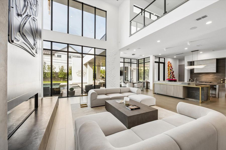 The home is filled with natural light and massive windows throughout the home. The home is filled with natural light and massive windows throughout the home.