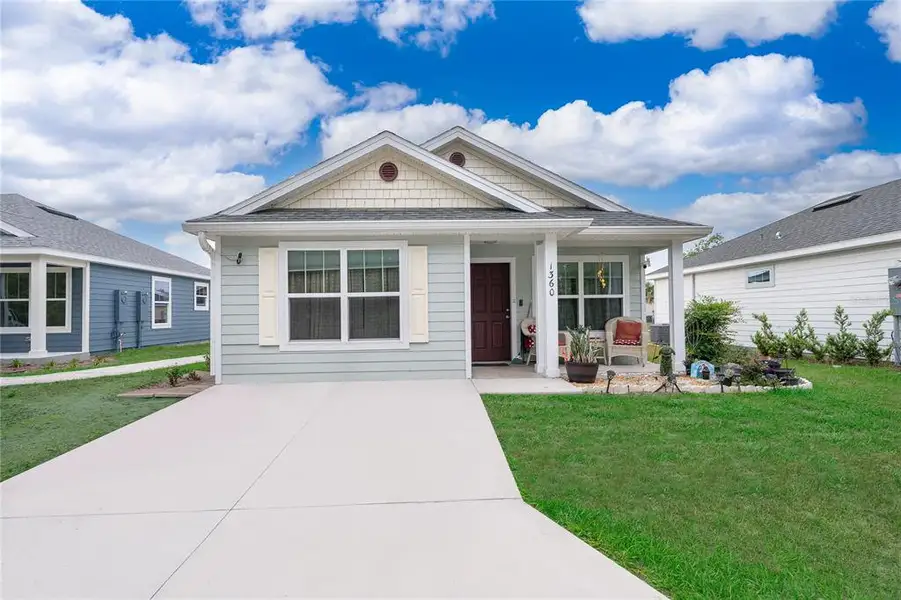 Front exterior of a new home in , Tavares, FL, highlighting curb appeal (Image 15).