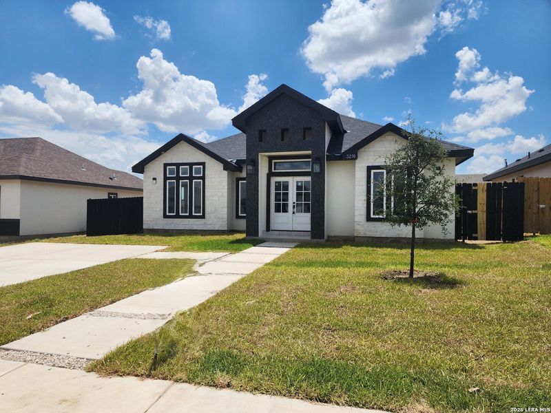 Front exterior of a new home in , Eagle Pass, TX, highlighting curb appeal (Image 20). Front exterior of a new home in , Eagle Pass, TX, highlighting curb appeal (Image 20).