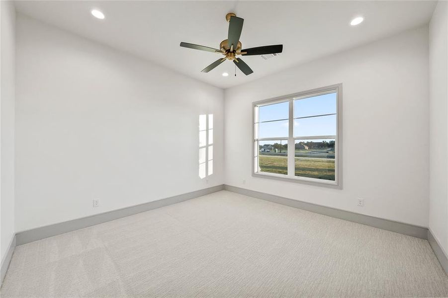 Spare room featuring light colored carpet, recessed lighting, and a ceiling fan Spare room featuring light colored carpet, recessed lighting, and a ceiling fan