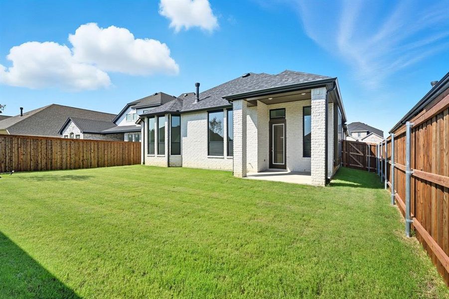 Front exterior of a new home in Trinity Falls, McKinney, TX, highlighting curb appeal (Image 2).