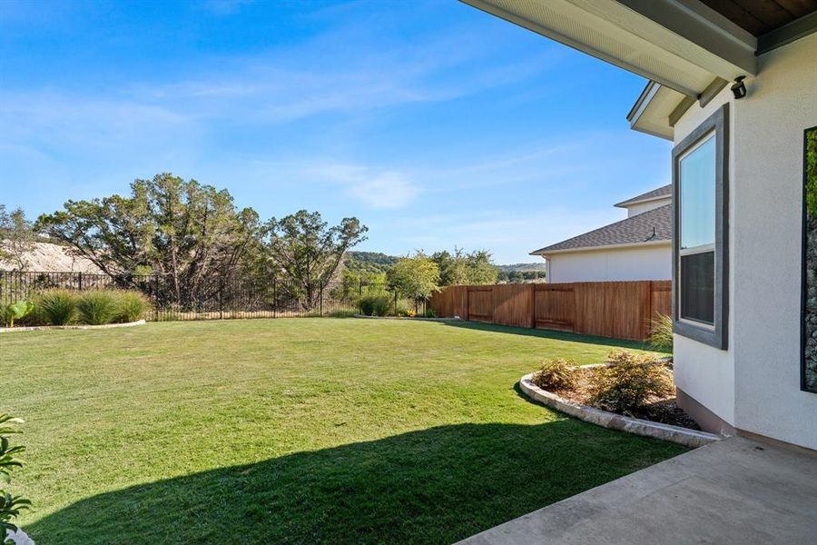 Views of the backyard from under the covered patio.