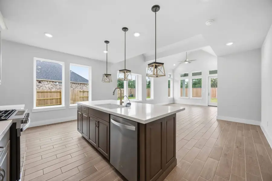Furnished interior view inside a new home in Ellwood, Iowa Colony (Image 9).