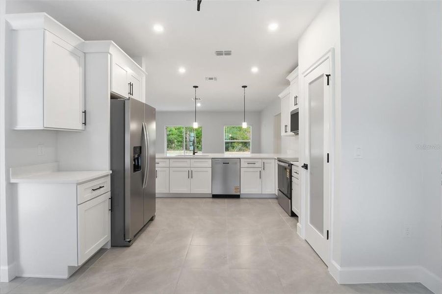 Furnished interior view inside a new home in , Dunnellon (Image 7).