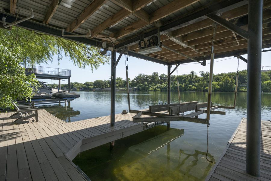 Dock with a water view and boat lift