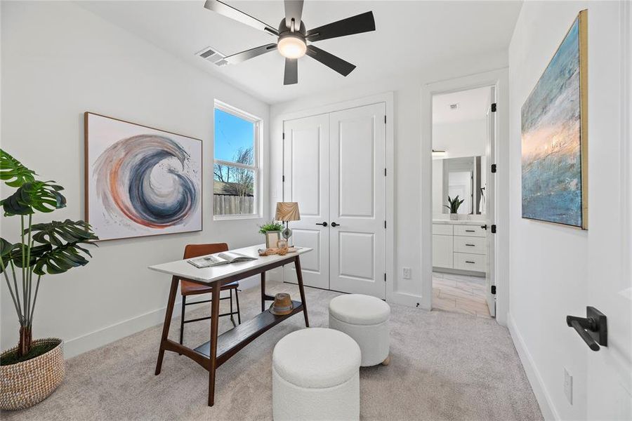 The first floor bedroom is staged as a beautiful home office. This room would also be great for guests, a home gym or game room.