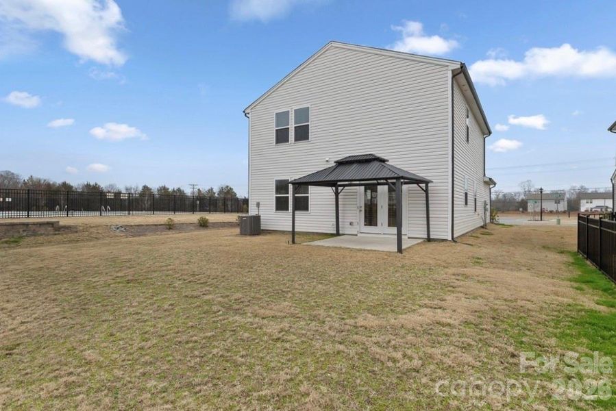 Exterior details and patio area of a home in Spring Meadow, Concord (Image 4).