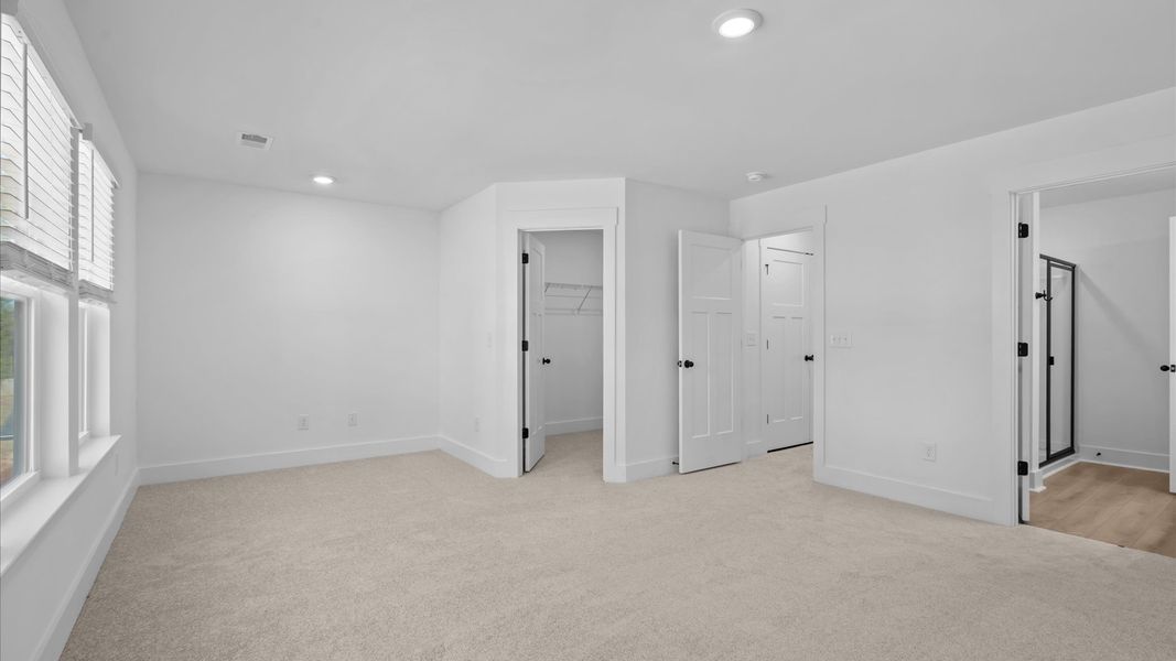 Memorable mornings begin in this tasteful and thoughtfully crafted primary suite