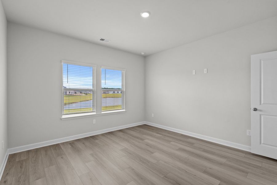 Spacious, unfurnished interior of a new home in Cypress Ridge - The Boardwalk Series, Longs (Image 22).
