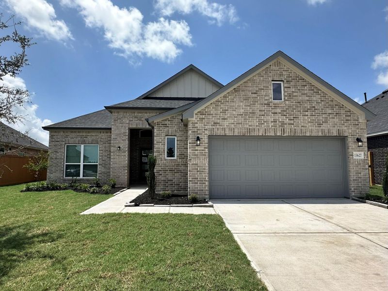 Front exterior of a new home in Creekhaven, Iowa Colony, TX, highlighting curb appeal (Image 2). Front exterior of a new home in Creekhaven, Iowa Colony, TX, highlighting curb appeal (Image 2).