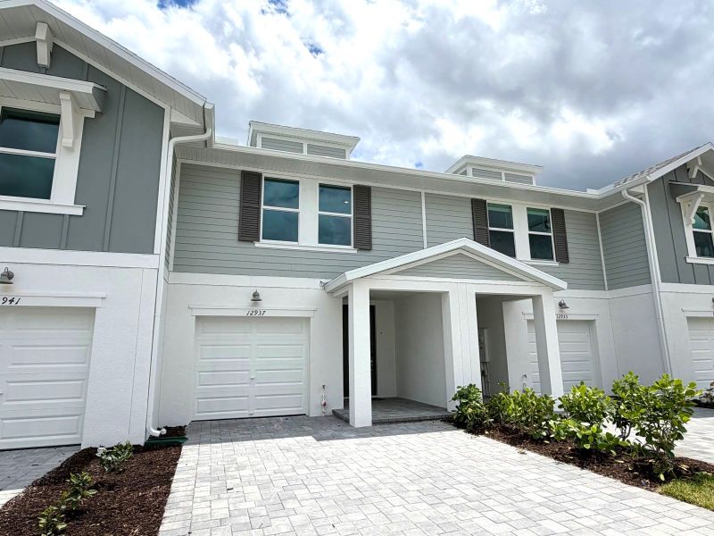 Front exterior of a new home in Meritage Homes at Central Park, Port St. Lucie, FL, highlighting curb appeal (Image 11).