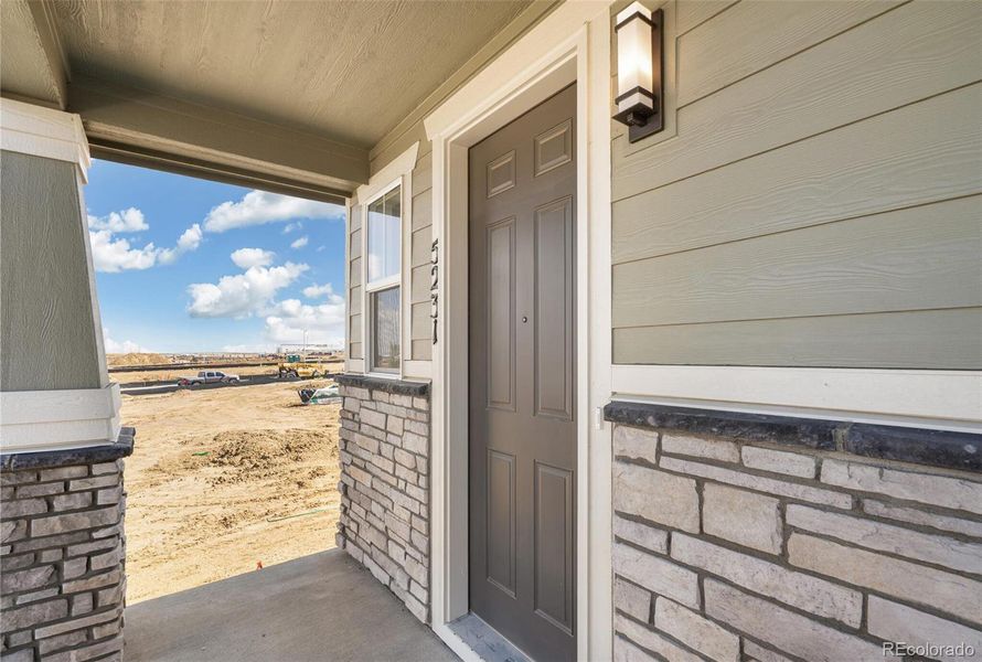 Exterior details and patio area of a home in Windler Villas, Aurora (Image 2).