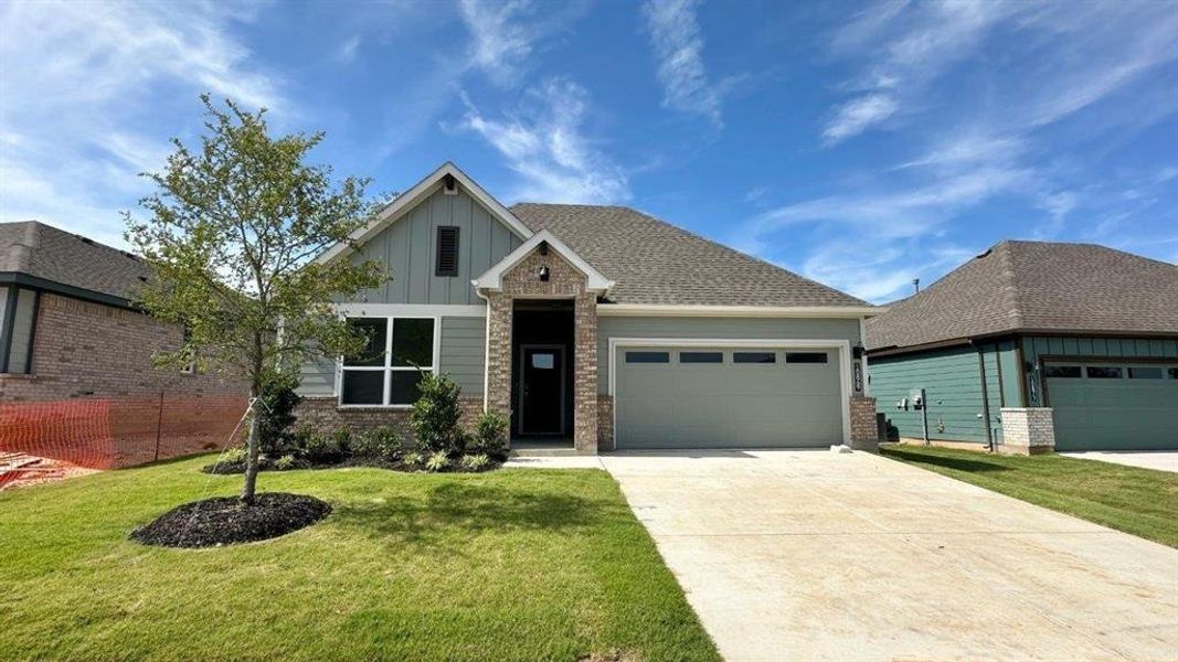 Front exterior of a new home in Rock Creek Ranch, Fort Worth, TX, highlighting curb appeal (Image 2). Front exterior of a new home in Rock Creek Ranch, Fort Worth, TX, highlighting curb appeal (Image 2).