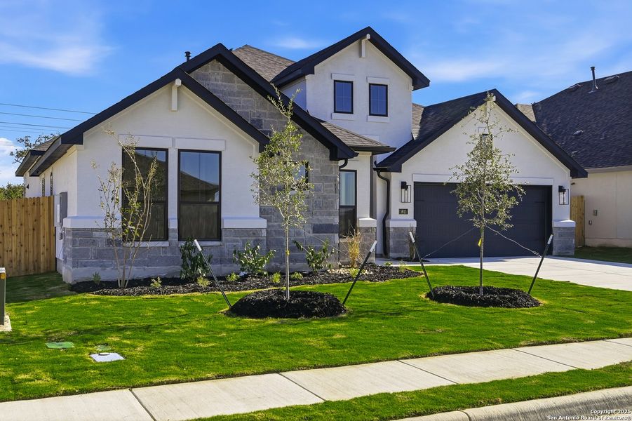 Front exterior of a new home in Ventana - 60', Bulverde, TX, highlighting curb appeal (Image 2).