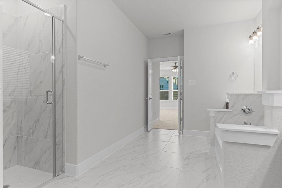 Another view showcases the open layout of the primary bath, highlighting the spacious design, high ceilings, and beautiful finishes that make this suite feel like your own private retreat. Another view showcases the open layout of the primary bath, highlighting the spacious design, high ceilings, and beautiful finishes that make this suite feel like your own private retreat.