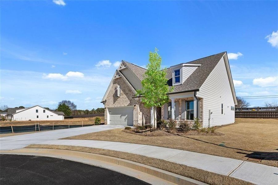 Front exterior of a new home in Soleil Summit Chase, Snellville, GA, highlighting curb appeal (Image 28).
