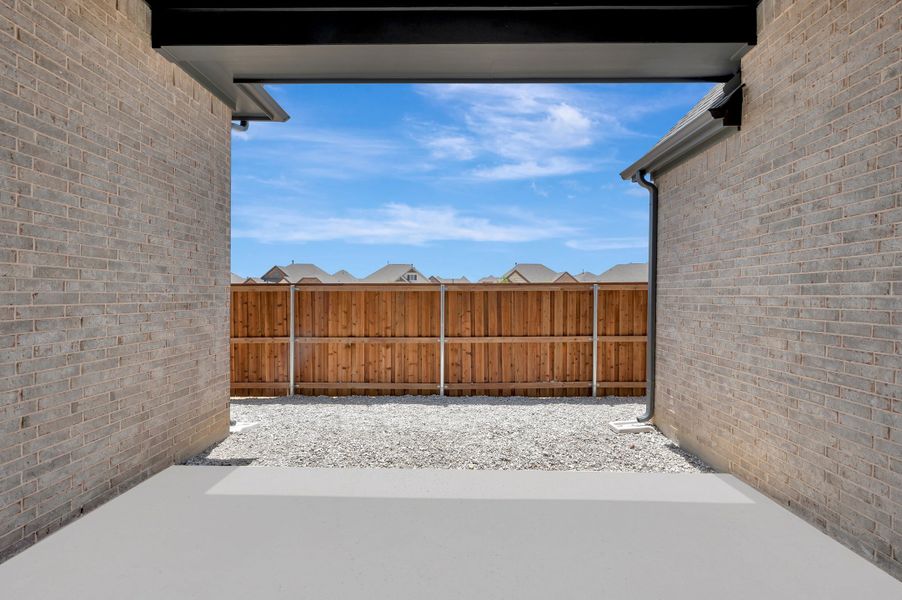 Exterior details and patio area of a home in Elements at Viridian - Garden Series, Arlington (Image 4). Exterior details and patio area of a home in Elements at Viridian - Garden Series, Arlington (Image 4).