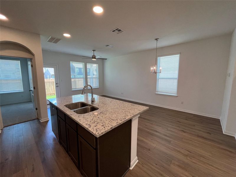 Kitchen open to dining and family room Kitchen open to dining and family room