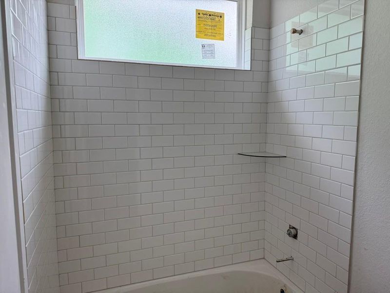 Full bath featuring shower / bath combination