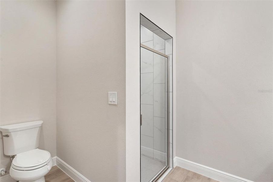 Primary Bathroom with Walk-in Shower and Water Closet