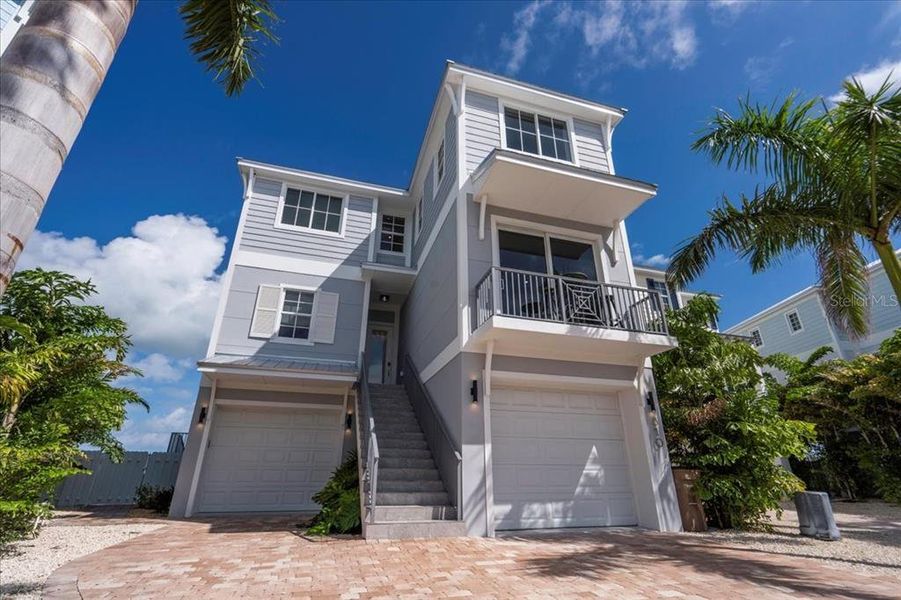 Front exterior of a new home in , Marathon, FL, highlighting curb appeal (Image 32). Front exterior of a new home in , Marathon, FL, highlighting curb appeal (Image 32).