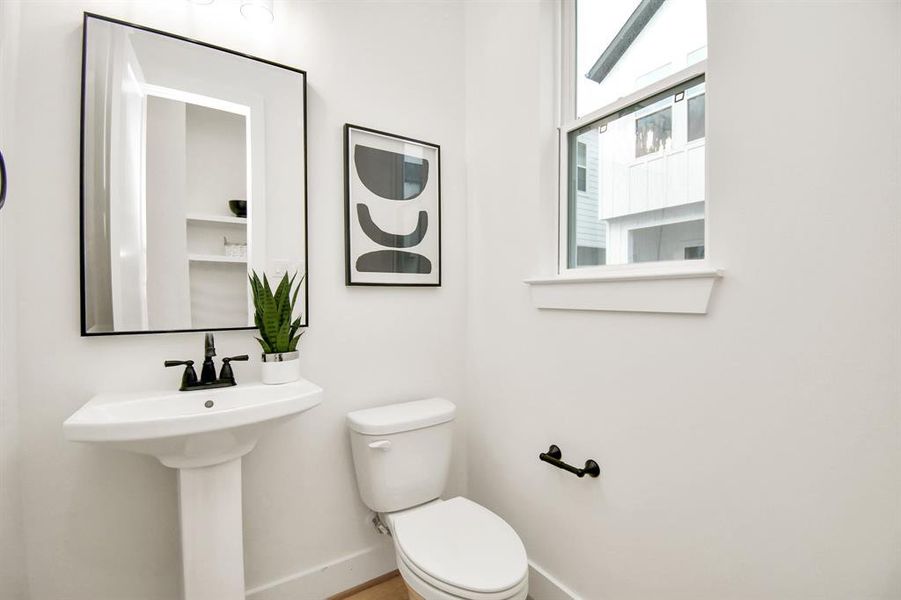 A charming powder bathroom located on the second floor.