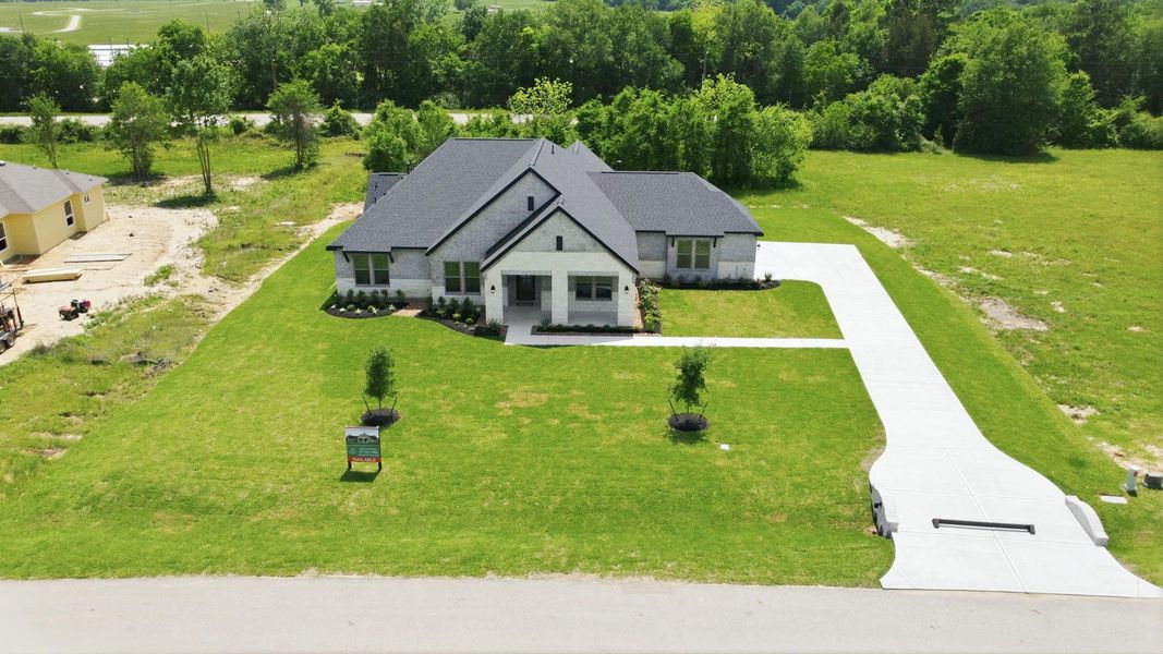 Front exterior of a new home in Chapel Bend, Montgomery, TX, highlighting curb appeal (Image 20). Front exterior of a new home in Chapel Bend, Montgomery, TX, highlighting curb appeal (Image 20).