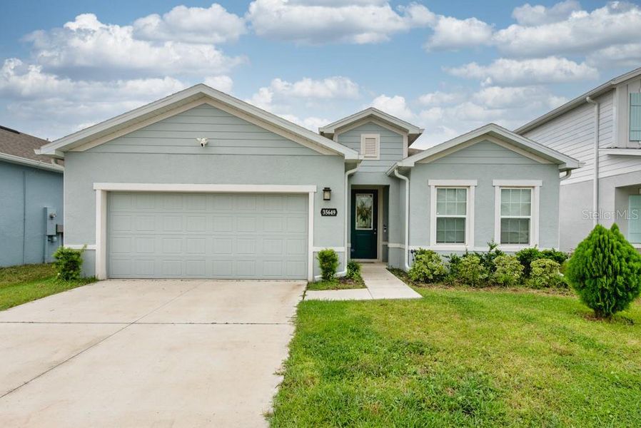 Front exterior of a new home in , Zephyrhills, FL, highlighting curb appeal (Image 21).
