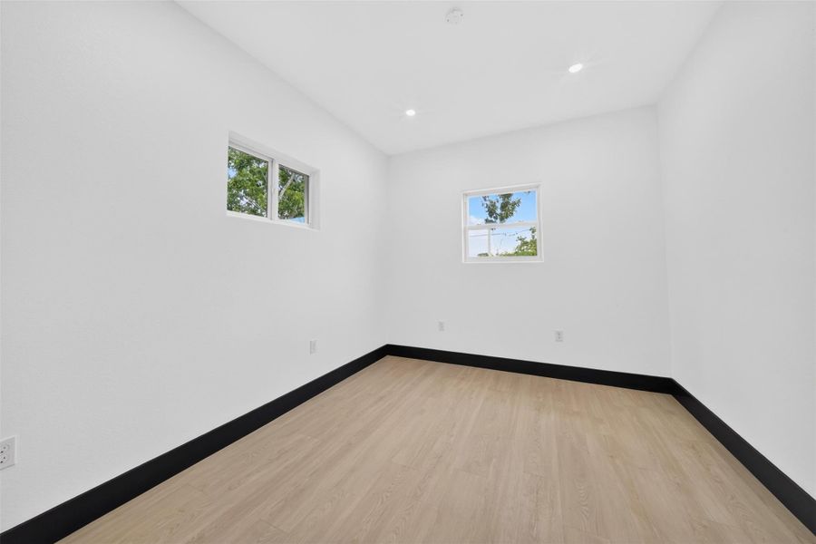 Additional bedroom with neutral finishes and flexibility for a variety of uses