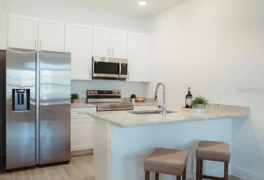 Furnished interior view inside a new home in , Kissimmee (Image 5).
