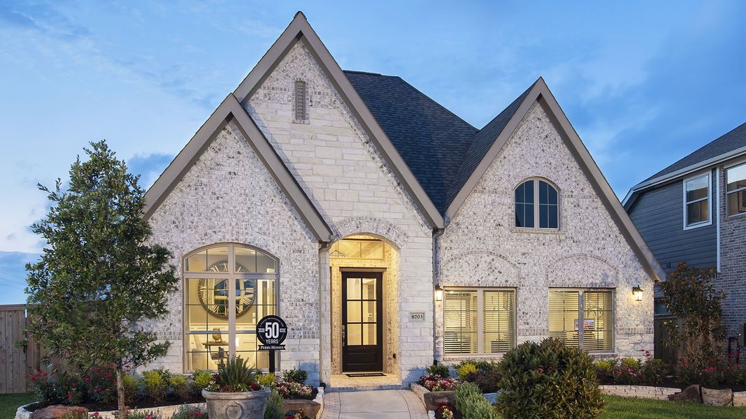 Representative exterior photo of a completed home built from the 2529W by Perry Homes in Santa Rita Ranch - Eldorado, Liberty Hill, TX (Image 24). Representative exterior photo of a completed home built from the 2529W by Perry Homes in Santa Rita Ranch - Eldorado, Liberty Hill, TX (Image 24).