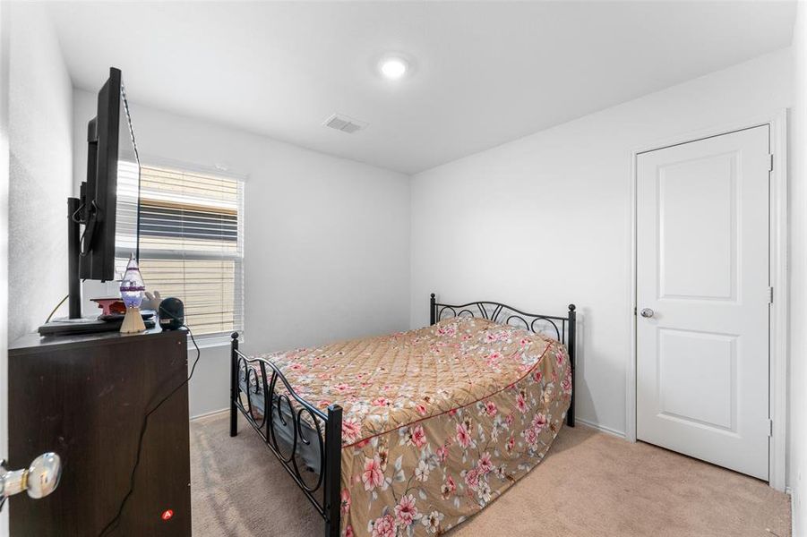 Bedroom with light carpet Bedroom with light carpet