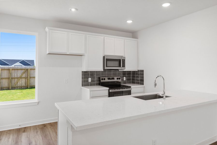 Representative furnished interior of a home built from the The 1340 by Stylecraft Builders in Townhomes at Yaupon Trails, Bryan (Image 4).