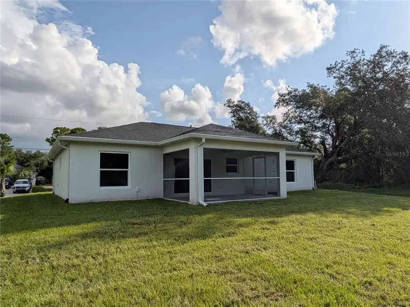 Exterior details and patio area of a home in , North Port (Image 24).