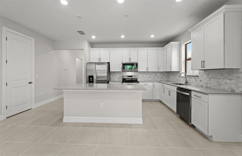 Furnished interior view inside a new home in Cedar Grove at The Woodlands, North Port (Image 5).