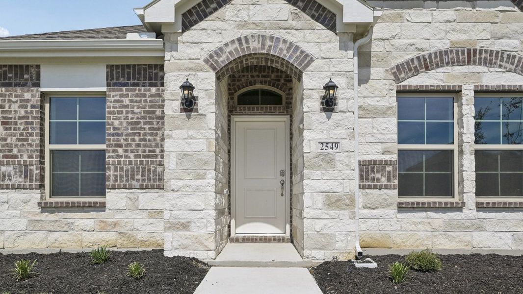 Representative exterior details of a home built from the Cambridge by D.R. Horton in Magnolia at Legacy Hills, Celina (Image 3).