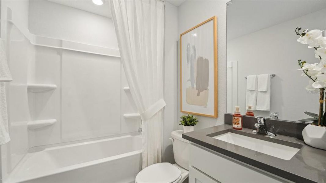 Furnished interior view inside a new home in Triumph South, Wildwood (Image 24).