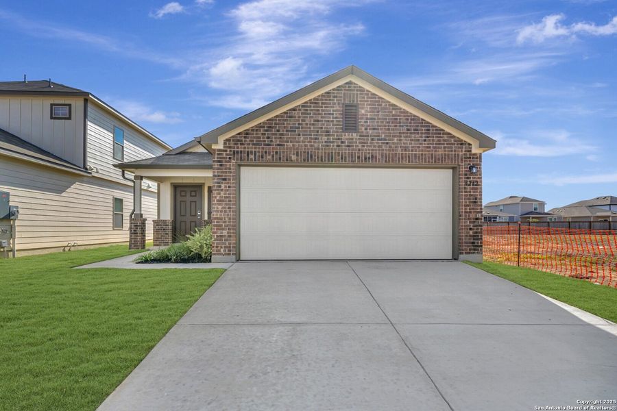 Front exterior of a new home in Park Place, New Braunfels, TX, highlighting curb appeal (Image 2).