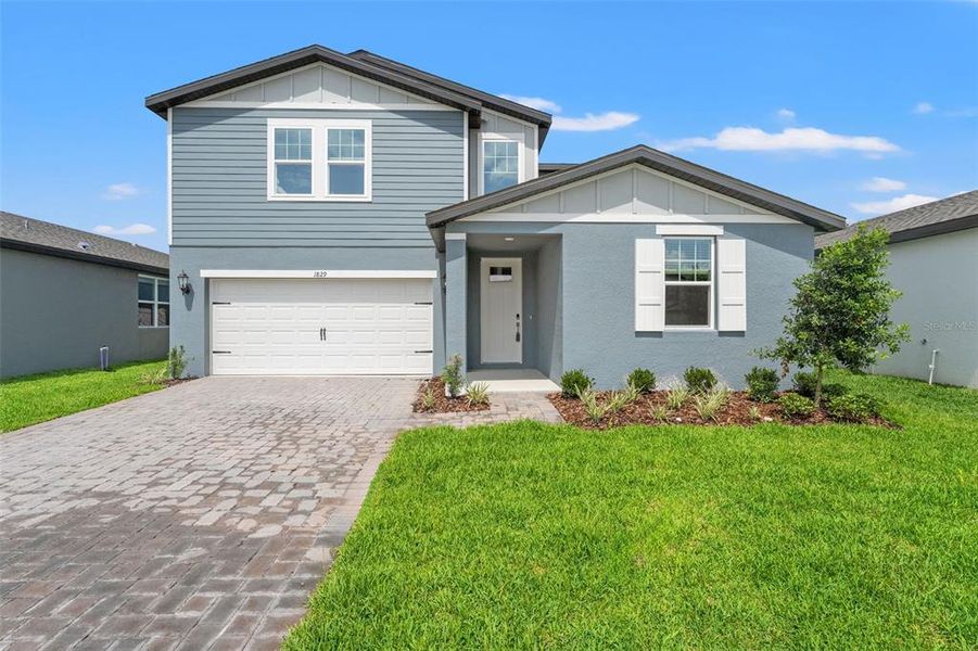 Front exterior of a home in the Two Rivers - Classic Series community, located in Zephyrhills, FL (Image 16). Front exterior of a home in the Two Rivers - Classic Series community, located in Zephyrhills, FL (Image 16).
