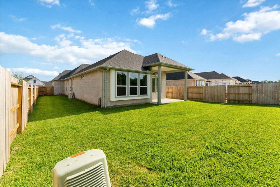 Exterior details and patio area of a home in Ellwood, Iowa Colony (Image 2).