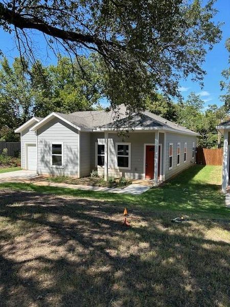 View of front of house featuring an attached garage and concrete driveway View of front of house featuring an attached garage and concrete driveway