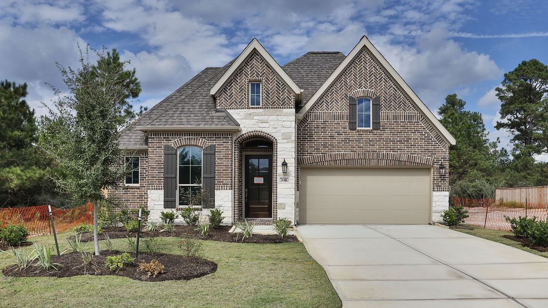 Front exterior of a new home in Kresston 50', Montgomery, TX, highlighting curb appeal (Image 1).
