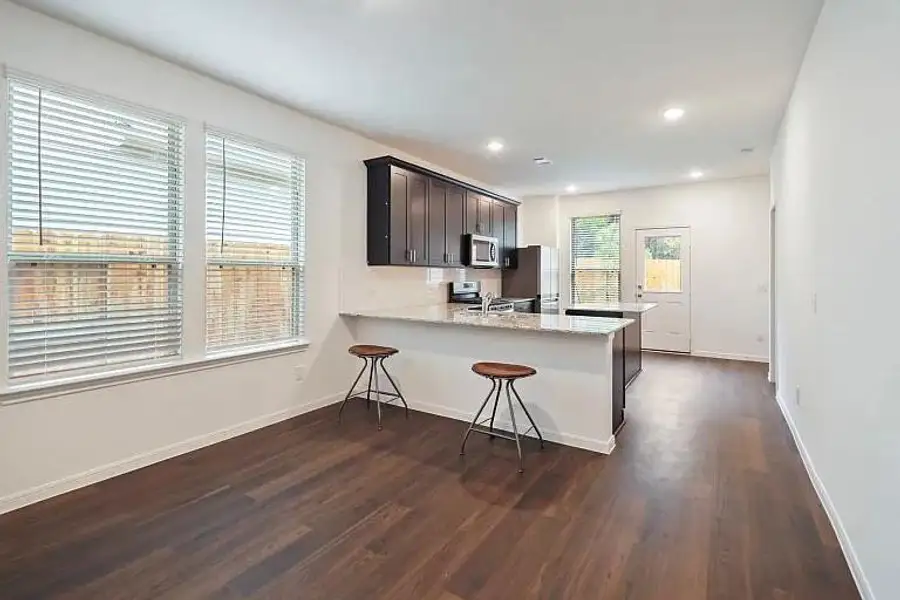 Furnished interior view inside a new home in The Pines At Seven Coves, Conroe (Image 10).