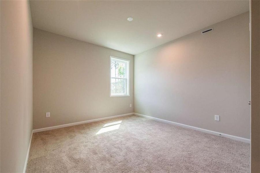 Spacious, unfurnished interior of a new home in The Paddocks at Doc Hughes, Buford (Image 26).