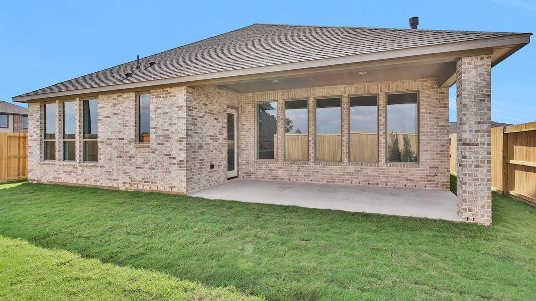 Front exterior of a new home in Cross Creek West 55', Fulshear, TX, highlighting curb appeal (Image 10). Front exterior of a new home in Cross Creek West 55', Fulshear, TX, highlighting curb appeal (Image 10).